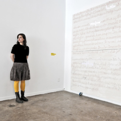 Mouna Andraos in front of her "6 is for blossom" artwork